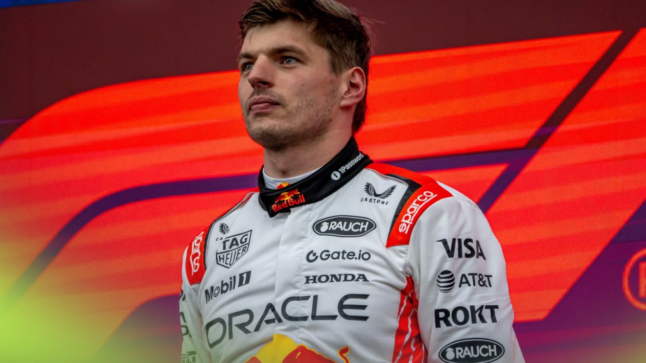 Max Verstappen stands on the podium victorious at the 2025 Japanese Grand Prix