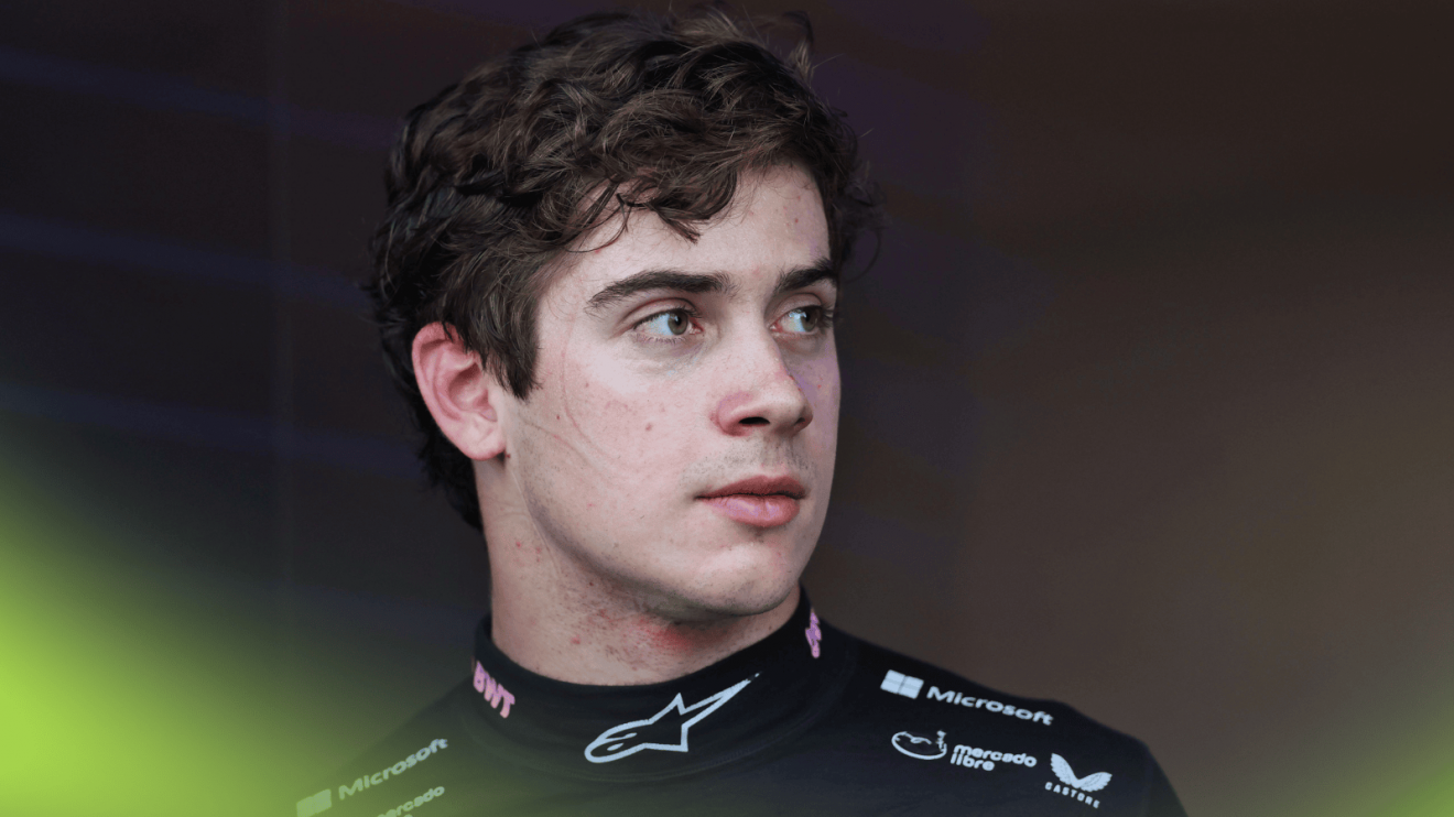 Franco Colapinto looks on while wearing an Alpine-branded fireproof top