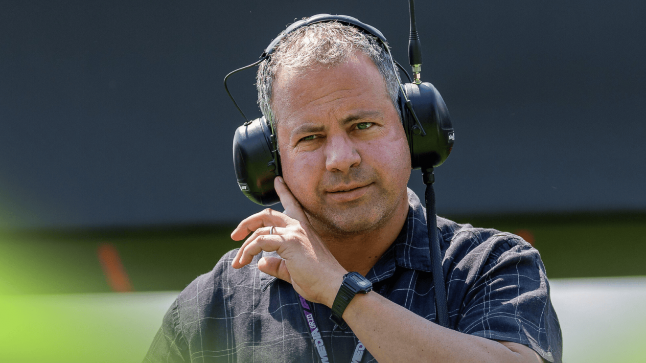 Ted Kravitz wearing a large set of headphones in the paddock