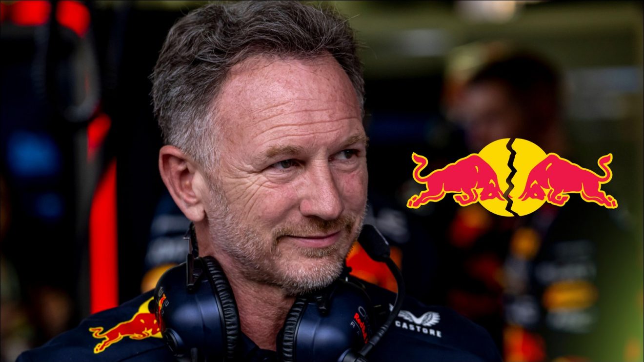 Former Red Bull team principal Christian Horner looks towards a split Red Bull logo on his right