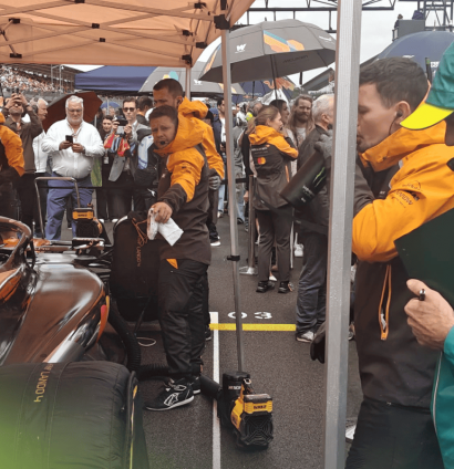 Adrian Newey studying the McLaren on the British Grand Prix grid