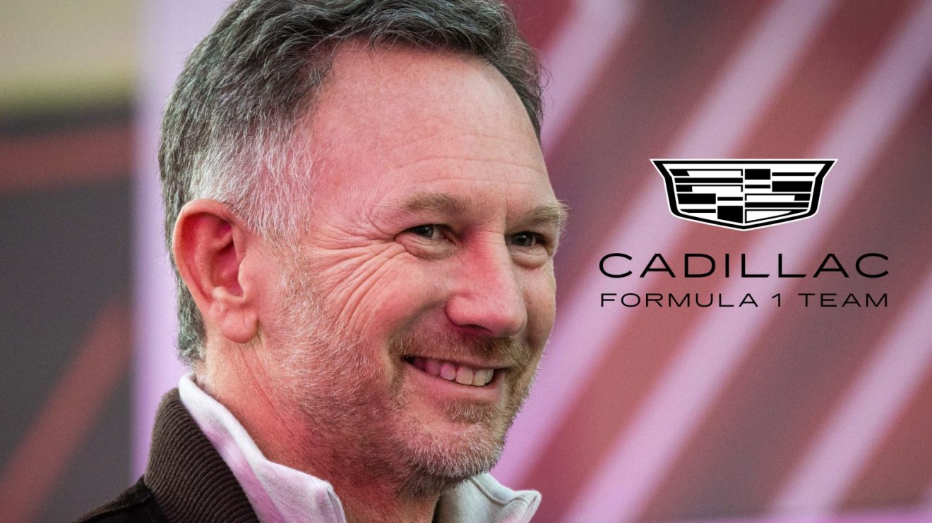 Former Red Bull boss Christian Horner smiling at the 2024 Las Vegas Grand Prix, as the Cadillac F1 badge appears on his right