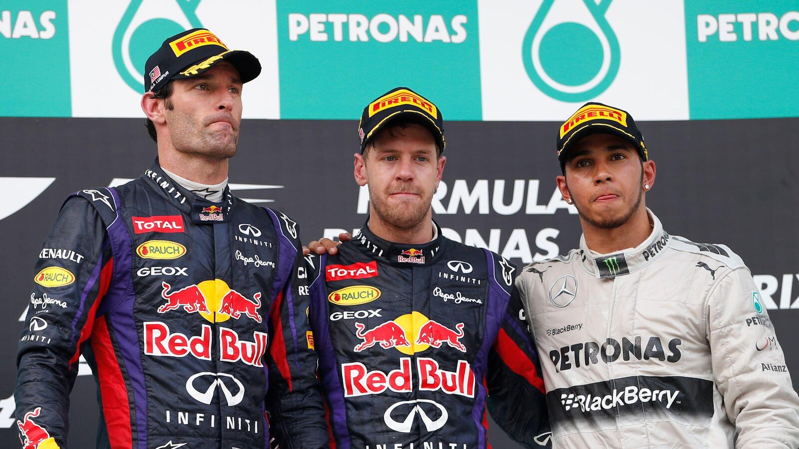 Sebastian Vettel, Mark Webber and Mercedes driver Lewis Hamilton pose together after awards ceremony for the Malaysian Formula 1 Grand Prix