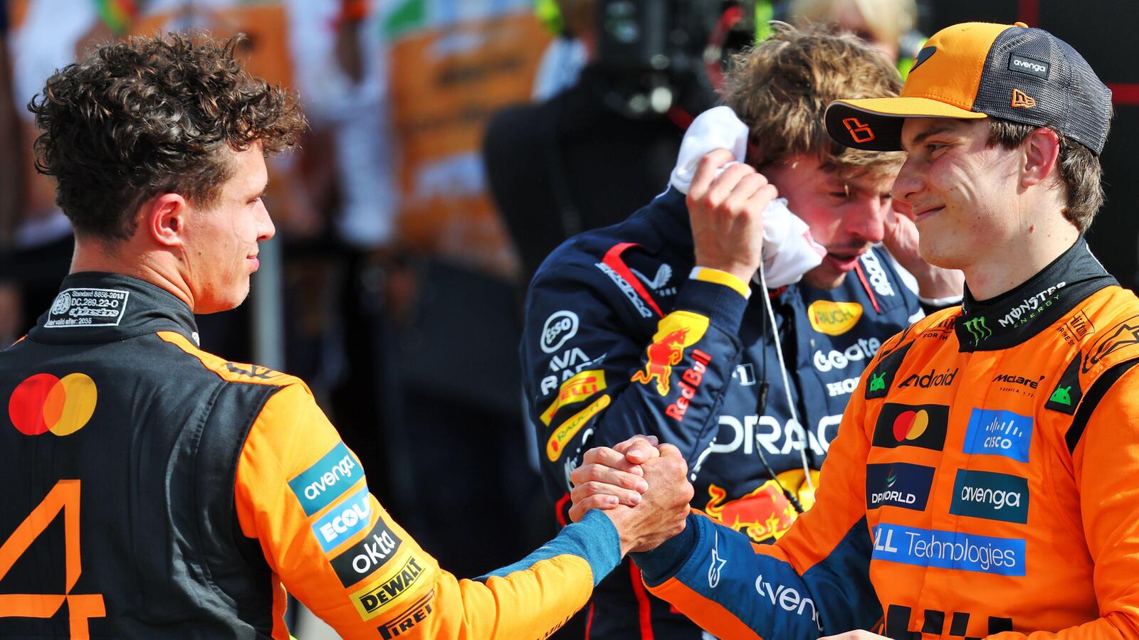 Lando Norris celebrates his second position with third placed teammate Oscar Piastri.