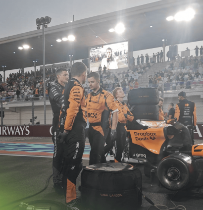 Adrian Newey studies Lando Norris's McLaren MCL39 on the grid in Qatar