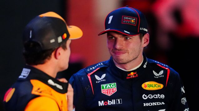 Max Verstappen smiling at Lando Norris