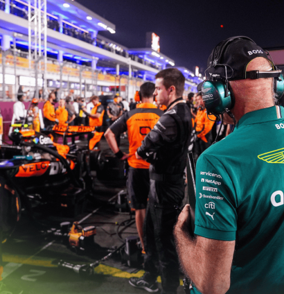 An over-the-shoulder shot of Adrian Newey looking at the McLaren MCL39 on the grid in Qatar