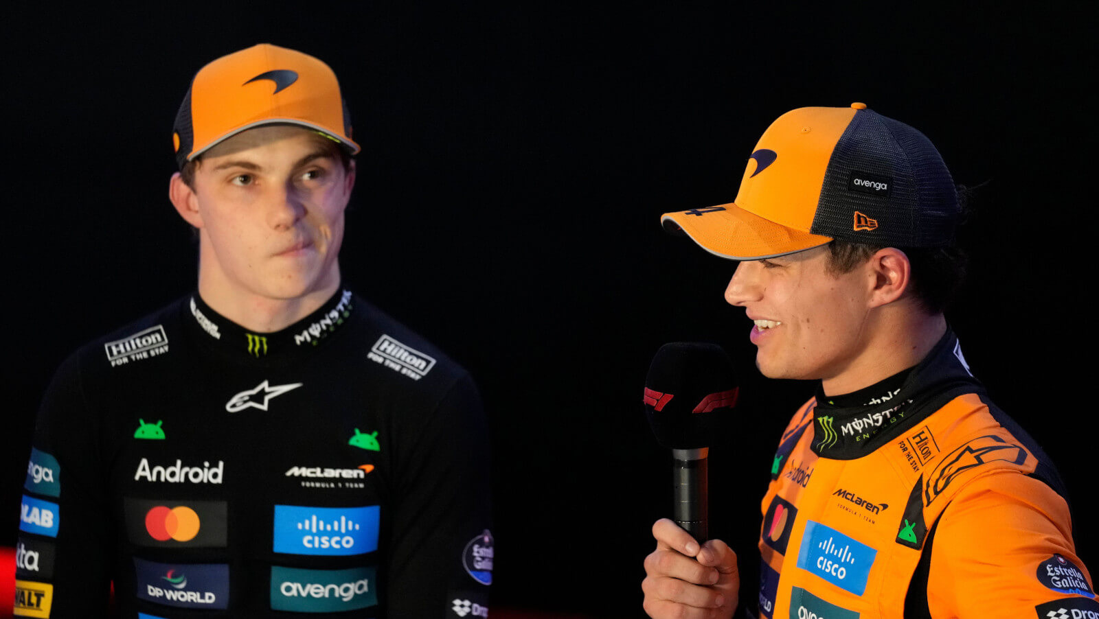 Oscar Piastri and Lando Norris on stage