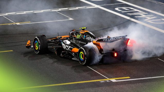 Lando Norris celebrates winning the F1 2025 world championship for McLaren.