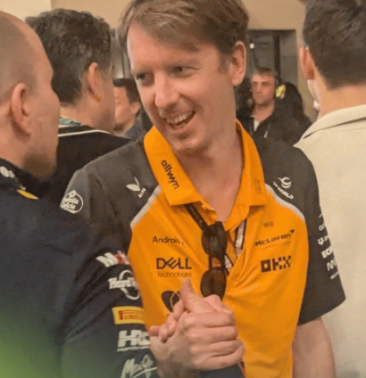 Will Joseph smiles as he clasps hands with Gianpiero Lambiase in the Abu Dhabi paddock