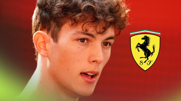 Oliver Bearman pictured at the 2025 Abu Dhabi Grand Prix, as a Ferrari logo appears on the right