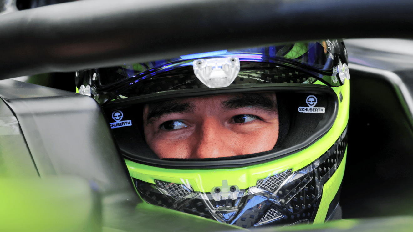 Sergio Perez's eyes visible through his open visor during the Cadillac shakedown