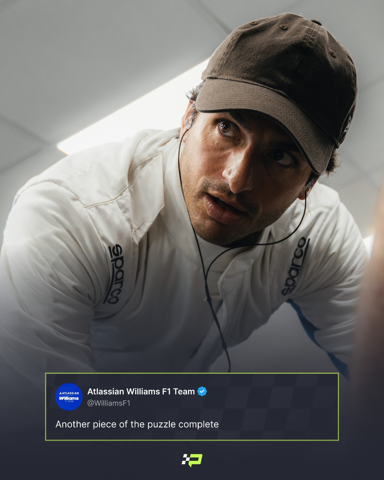Carlos Sainz in a cap and plain-white race suit with a Williams tweet and PlanetF1.com logo positioned centre-bottom