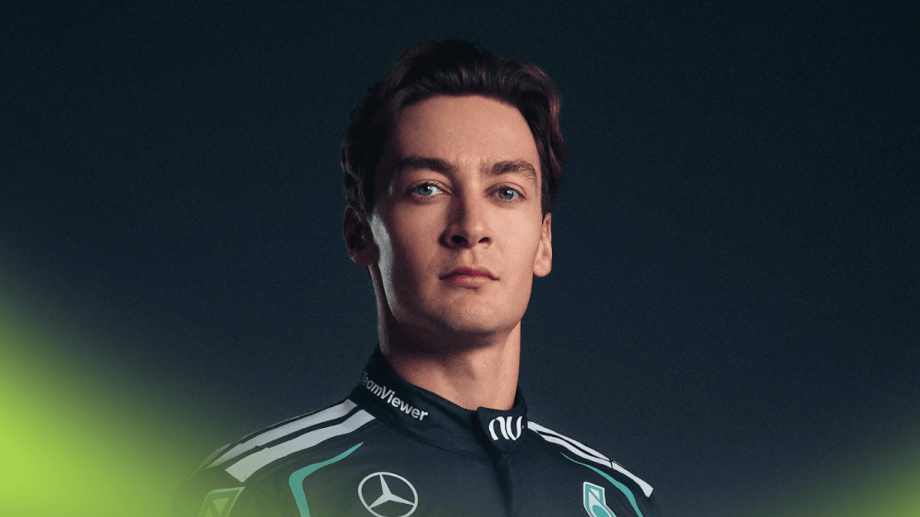 A portrait shot of George Russell modelling the 2026 Mercedes overalls