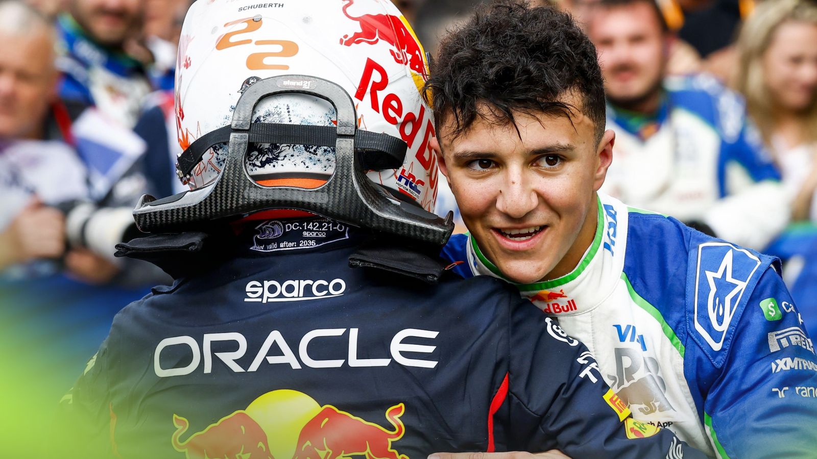 Max Verstappen, Red Bull, left, and Isack Hadjar, Racing Bulls, right, embrace at the 2025 Dutch Grand Prix