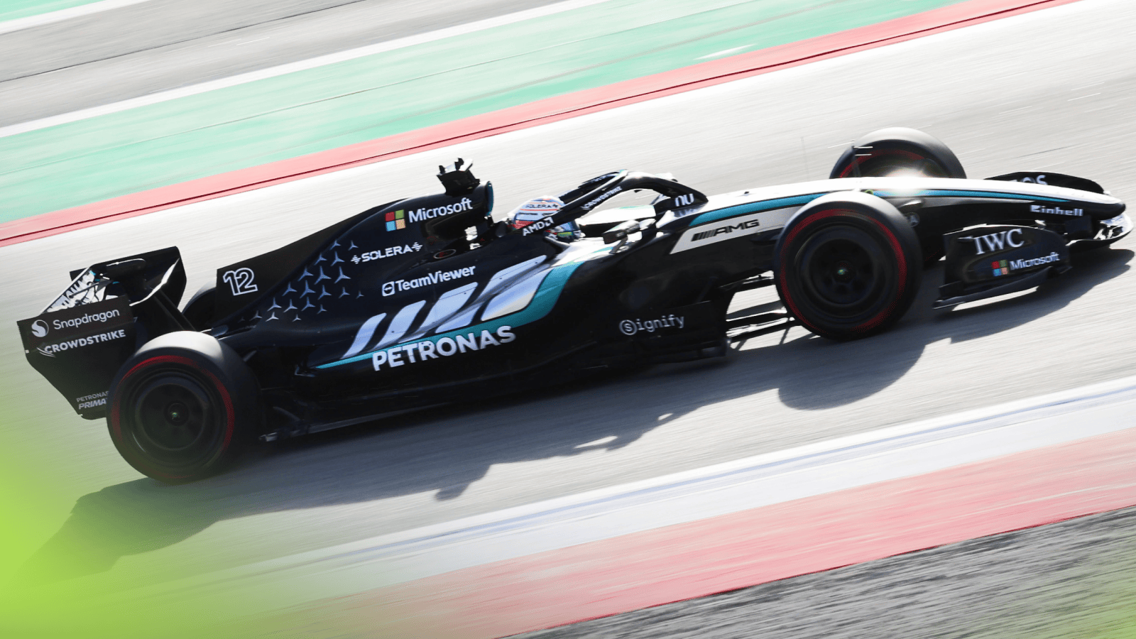 An action shot of Kimi Antonelli's Mercedes on track at a sunny Barcelona