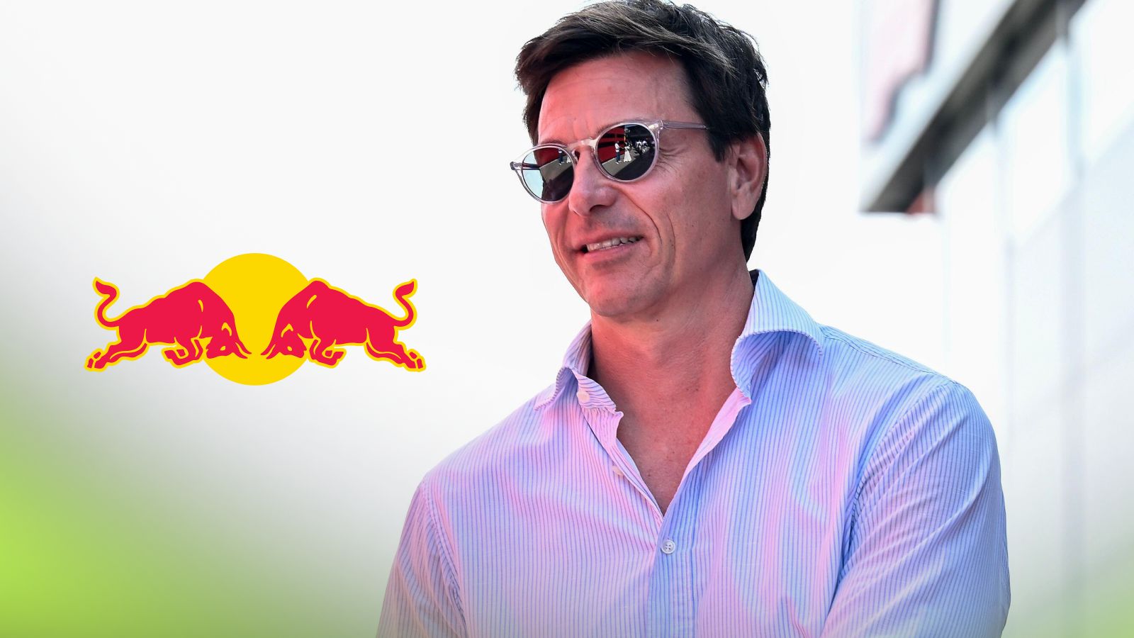Mercedes team boss Toto Wolff pictured at the 2025 Italian Grand Prix, as a Red Bull logo appears on the left