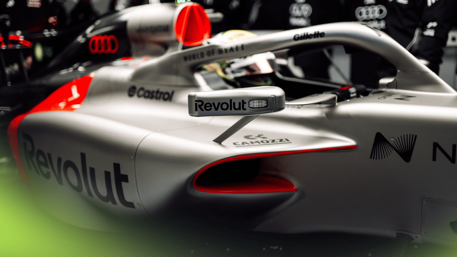 Gabriel Bortoleto sitting in the Audi R26 car in the garage