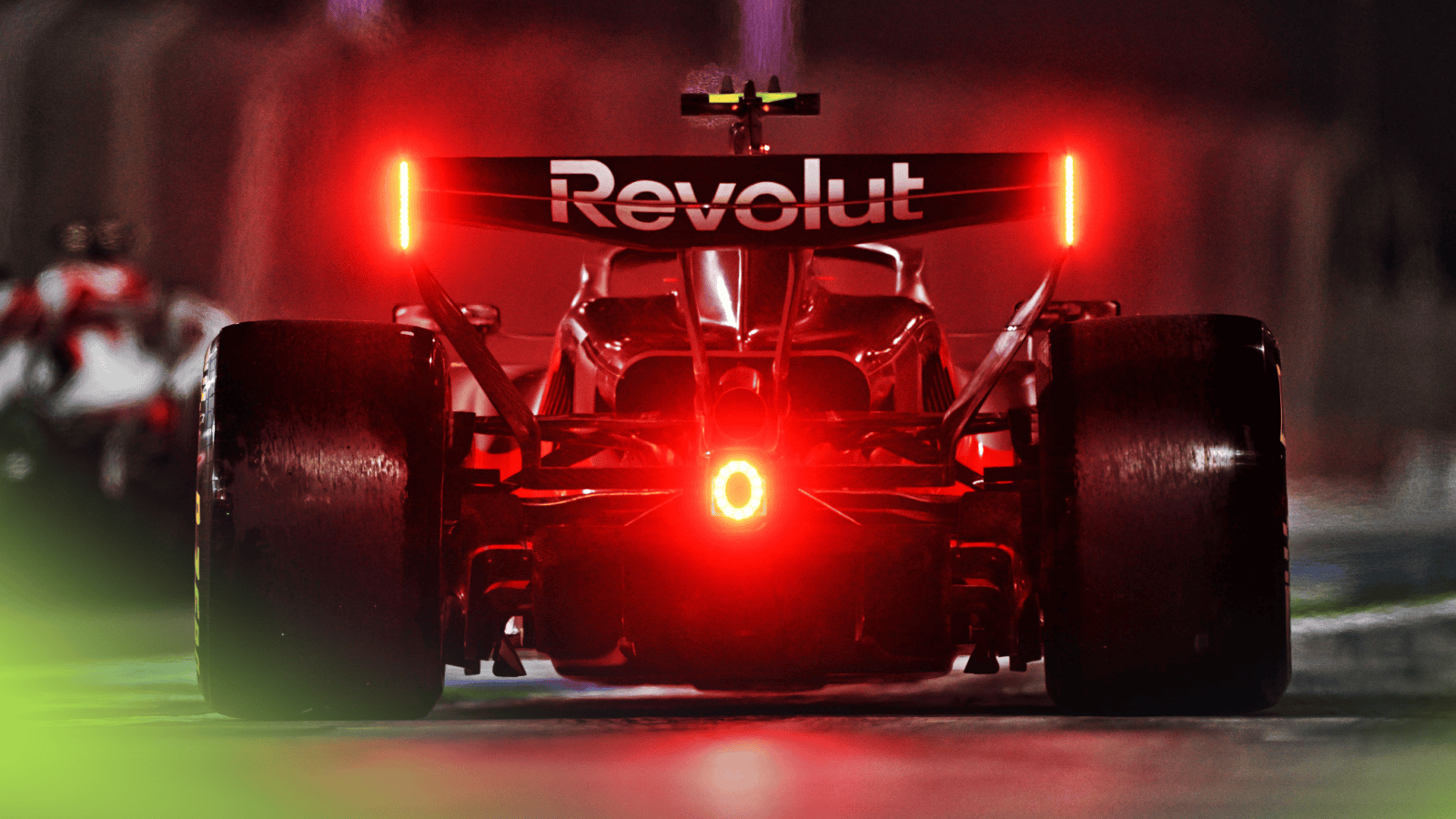 A rear-facing shot of Gabriel Bortoleto's Audi with his rear lights flashing red in the Bahrain pit lane