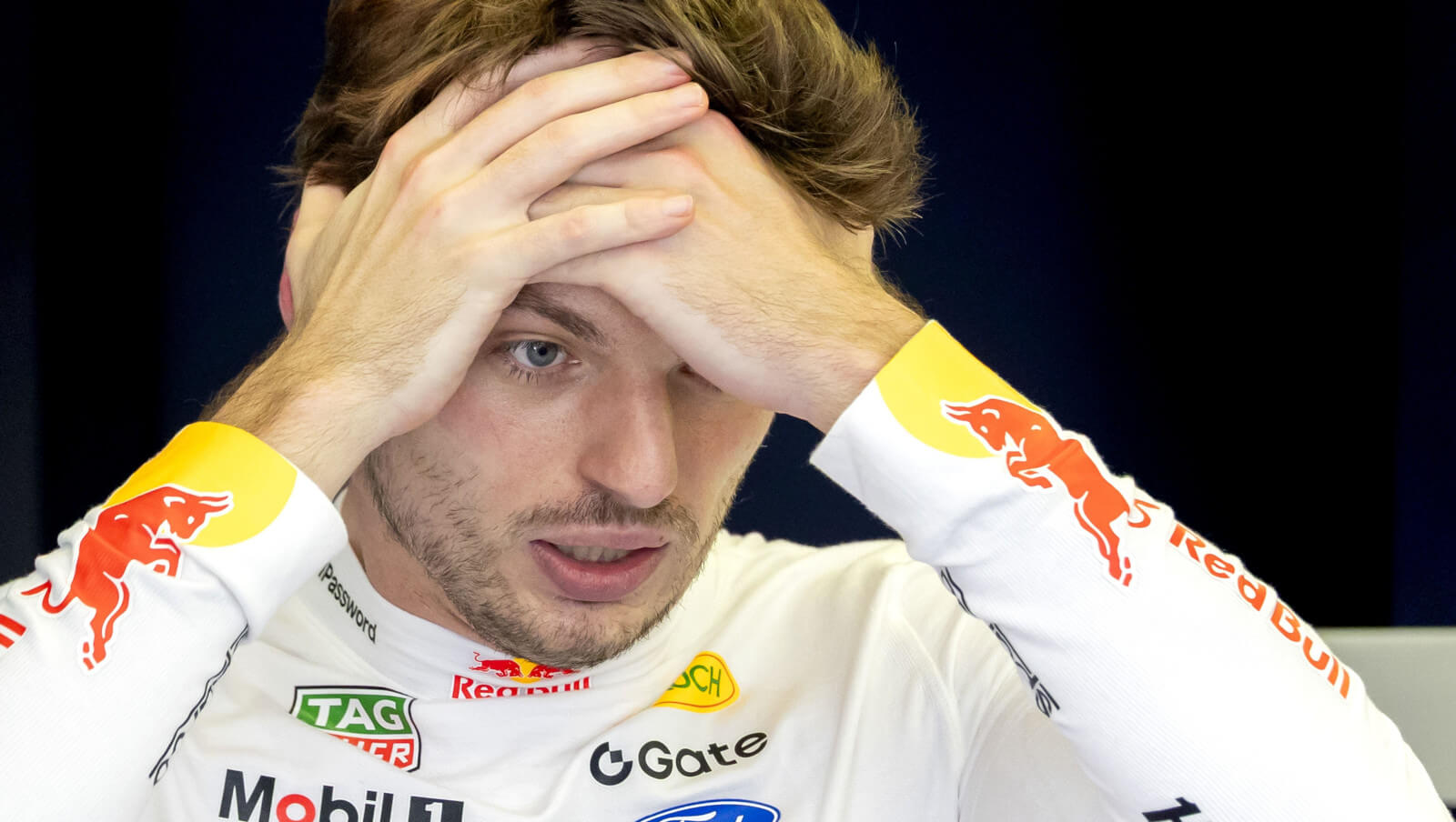 Max Verstappen with his hands to his head