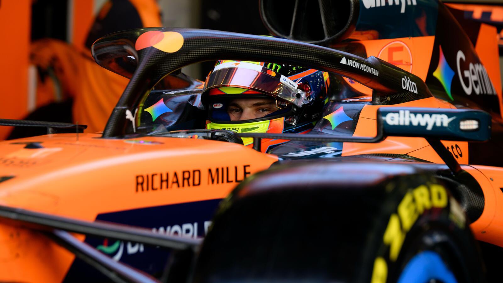 Oscar Piastri sits in his McLaren with his visor up during Bahrain testing.