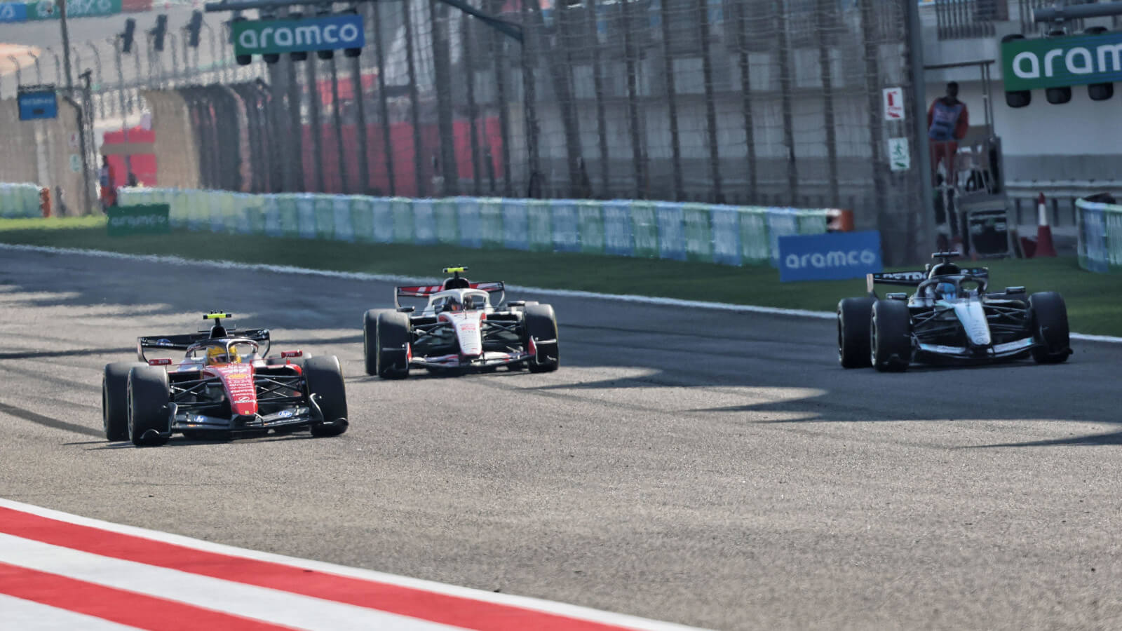 Lewis Hamilton passes George Russell in a practice race start