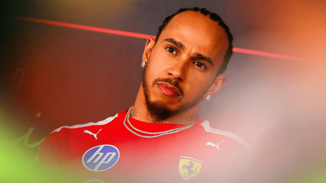 Lewis Hamilton looks on in a press conference in Bahrain