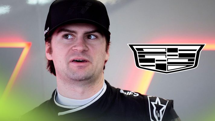 Colton Herta pictured at 2026 F2 testing in Barcelona, as a Cadillac logo appears on the right