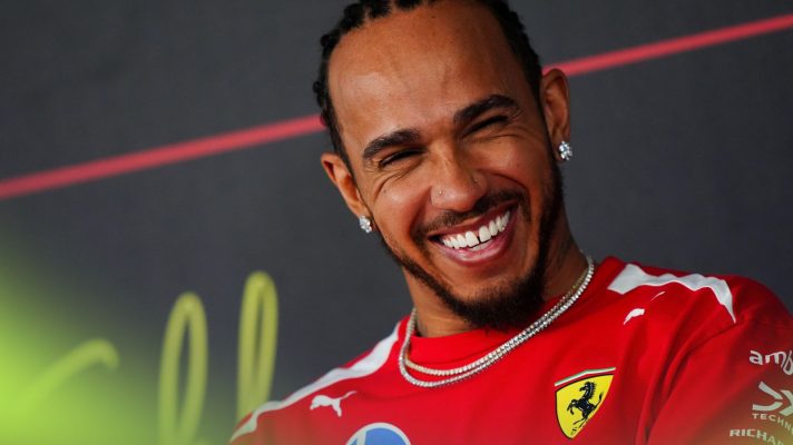 Lewis Hamilton smiling during a Bahrain 2026 testing press conference
