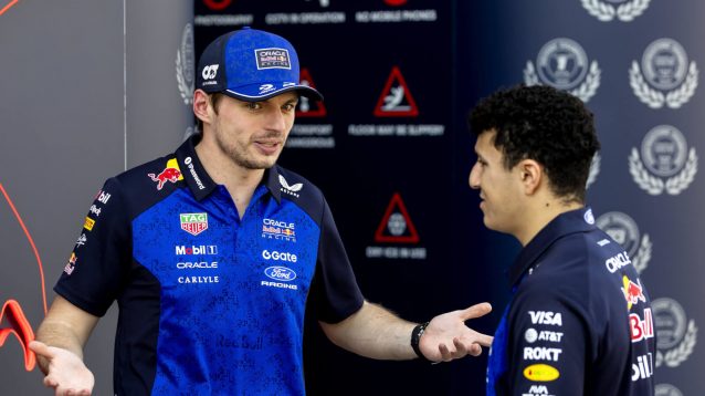 Max Verstappen speaking with Isack Hadjar