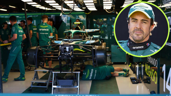 Aston Martin mechanics work on Fernando Alonso's car