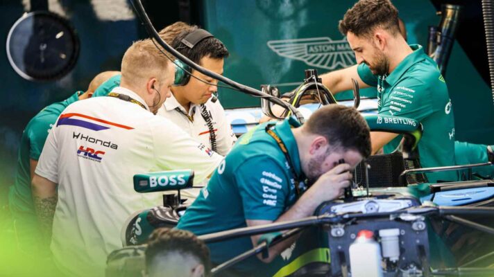 Honda and Aston Martin engineers work on the AMR26.