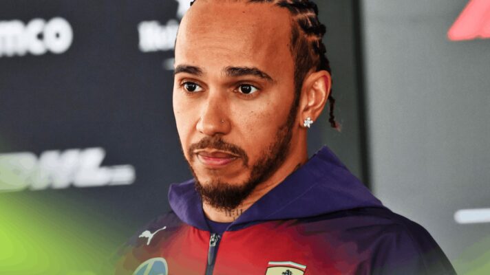 Lewis Hamilton looks serious as he faces the media