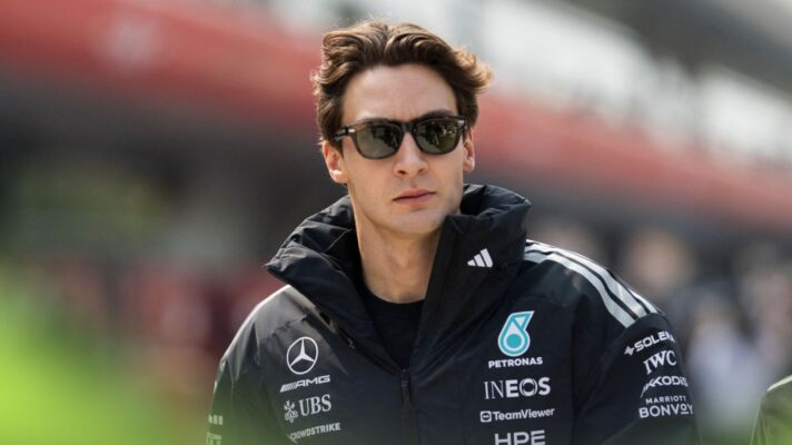 George Russell walks through the paddock in Shanghai.