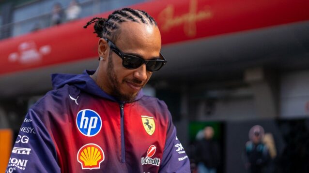 Lewis Hamilton wearing Ferrari's purple Chinese GP team wear.