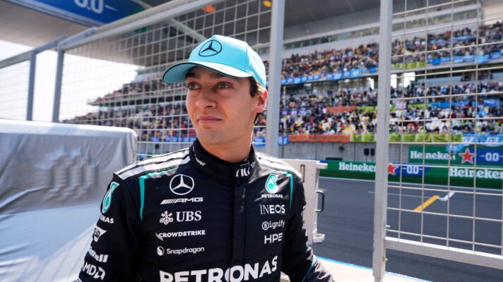 George Russell stands at the pit wall in Shanghai.