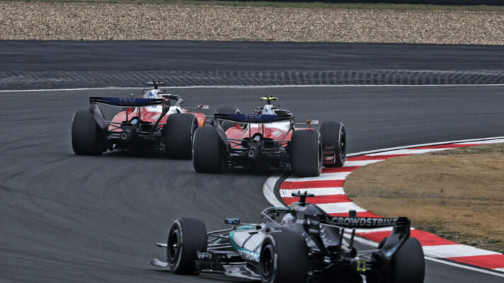 Charles Leclerc and Lewis Hamilton fighting ahead of George Russell