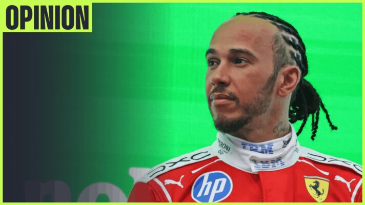 Lewis Hamilton stands on the podium with an 'opinion' tab in the top-left corner