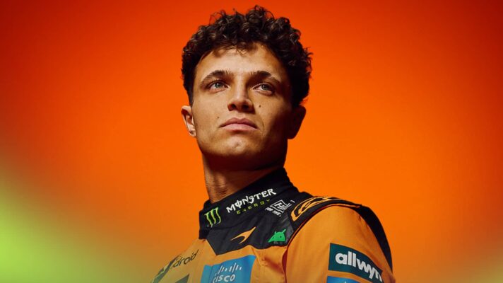 A studio shot of Lando Norris posing in McLaren's 2026 race overalls
