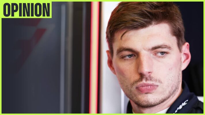 Max Verstappen looks downbeat in the Red Bull garage