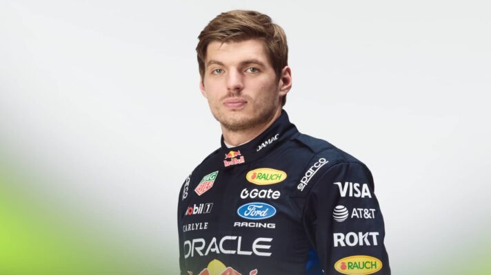 A studio shot of Max Verstappen in Red Bull 2026 overalls