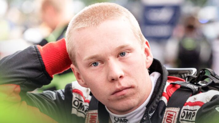 Kalle Rovanpera rests his hand on the back of his head