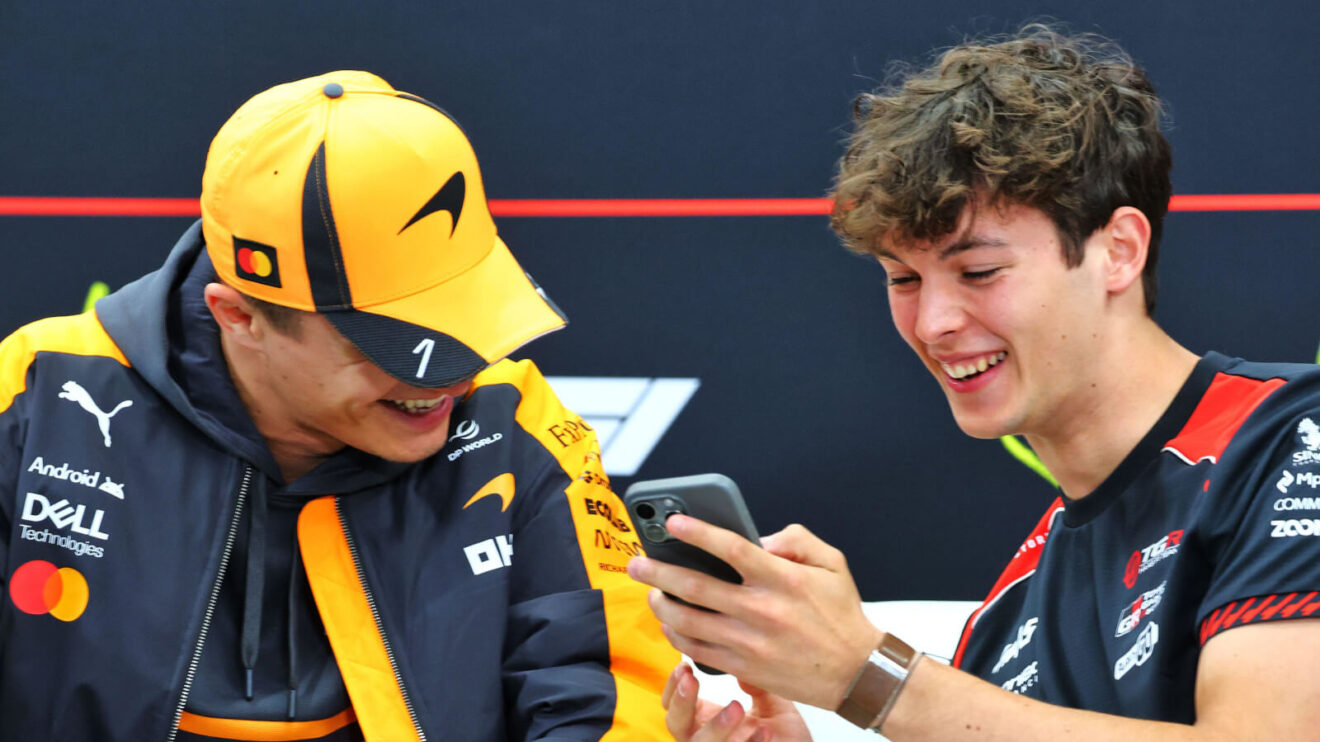 Lando Norris laughing with Oliver Bearman