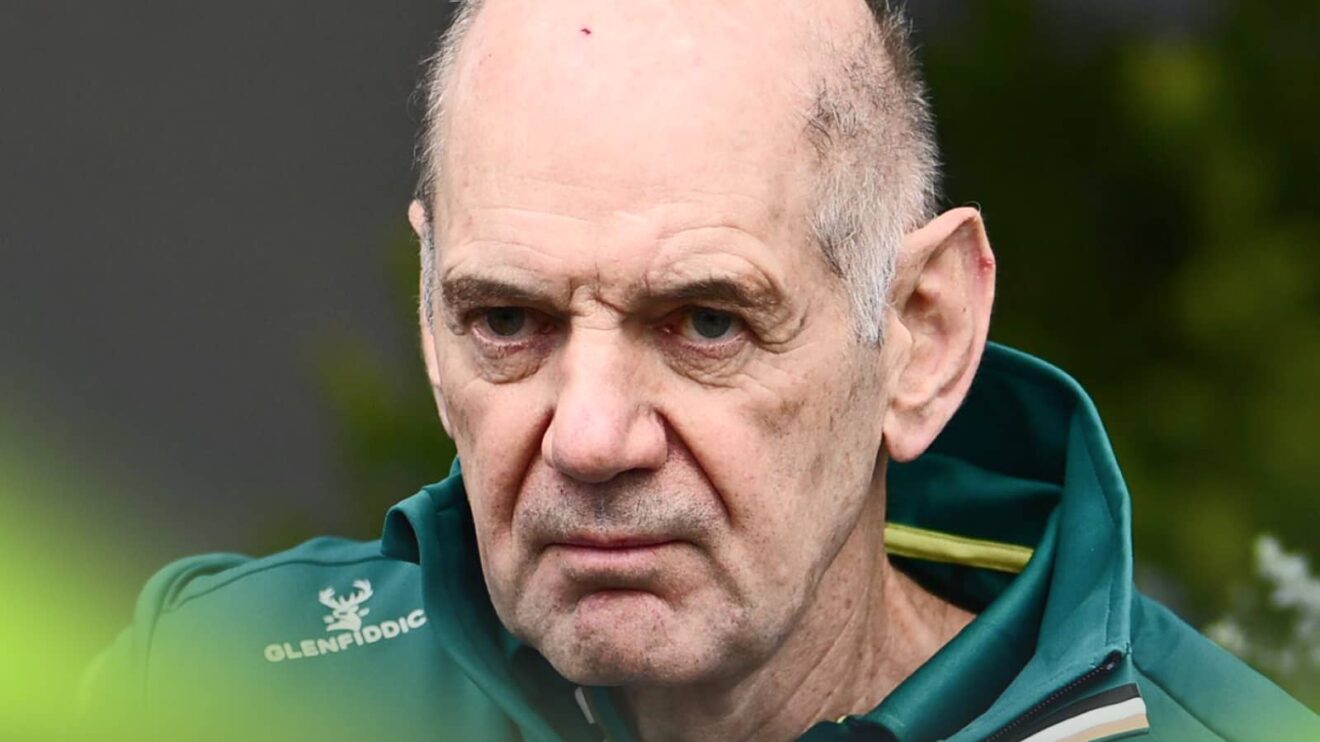 A close-up shot of Adrian Newey in Aston Martin team kit