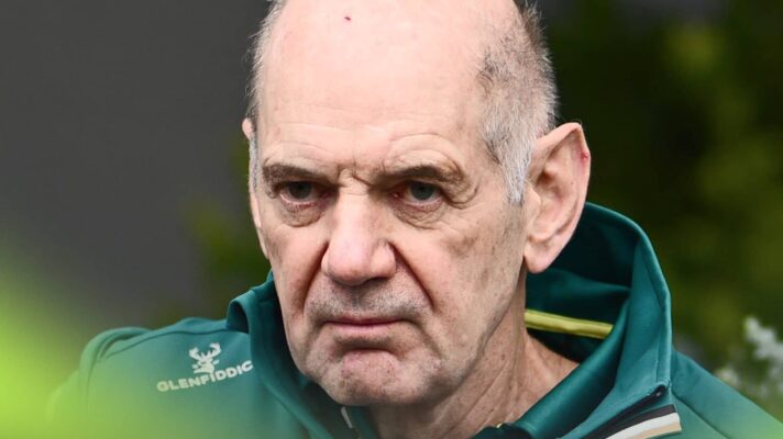 A close-up shot of Adrian Newey in Aston Martin team kit