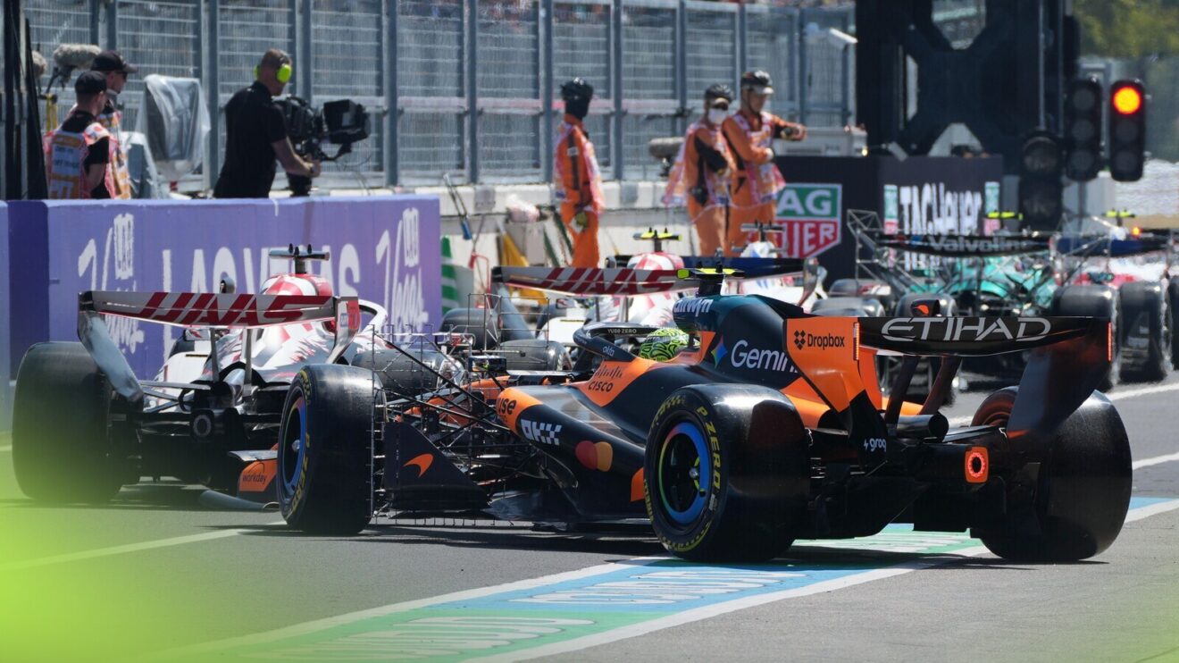 Lando Norris joins a queue of cars at pit exit as they wait to head out on track in Japan.