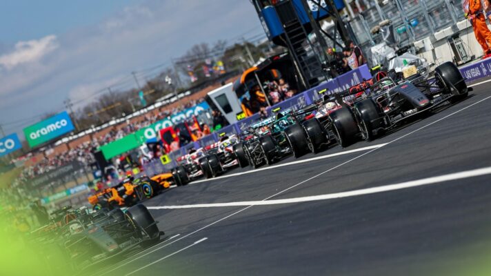 Cars queue up at the pit lane exit during Practice ahead of the F1 Grand Prix of Japan at Suzuka