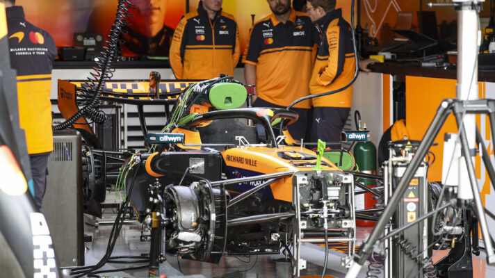 The McLaren MCL40 being prepared for action, with the front brake disc fairing in place, whilst the caliper has yet to have its fairing fitted.