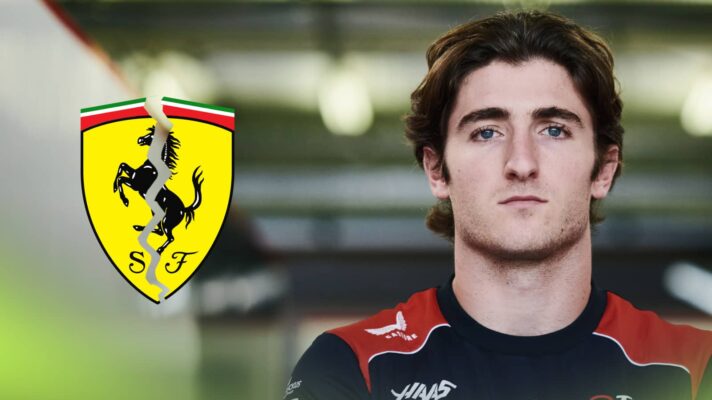 Jack Doohan posing in Haas team kit with a cracked Ferrari logo alongside him