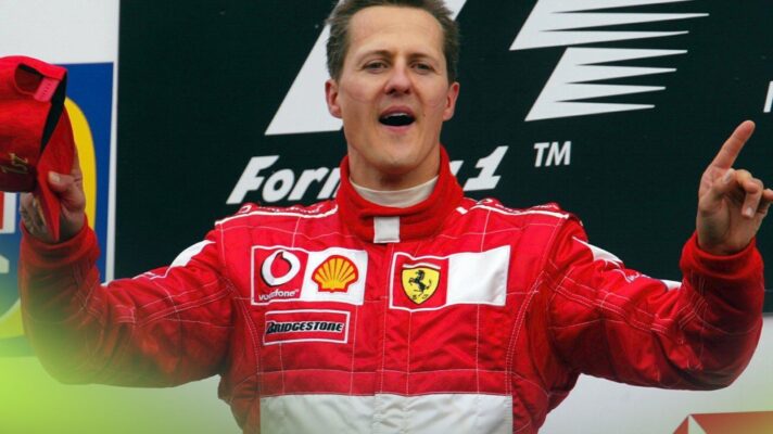 Ferrari driver Michael Schumacher celebrates on the podium at the 2003 United States Grand Prix